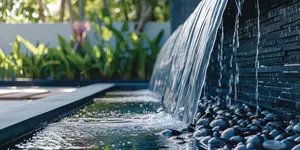Modern outdoor home water feature fountain waterfall as wide banner with copy space area for garden landscape design concepts.
home, decoration, waterfall, landscape, exterior, garden, decorative, architecture, feature, water, palace, hotel, lighting, resort, luxury, modern, pool, porch, fountain, zen, gardening, tiling, contractor, service, fitting, landscaping, plant, romantic, cosy, tree, backyard, allotment, decor, design, luxurious, residence, fall, flowing, splashing, stone, wall, house, copy space, copy, space, banner, stream, splash, nature